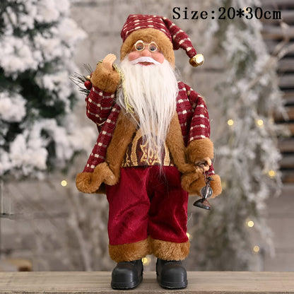 Santa figurine holding a gift sack and teddy bear, featuring festive details and a cheerful design, perfect for holiday decor or as a charming centerpiece.