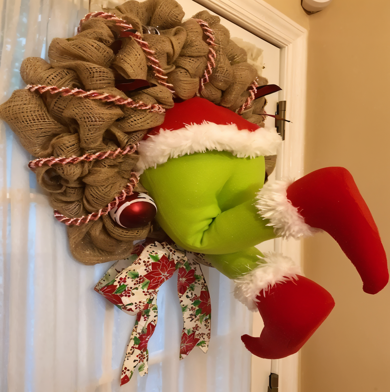 Festive door ornament featuring a playful and whimsical design, perfect for adding charm and holiday cheer to your seasonal decorations.