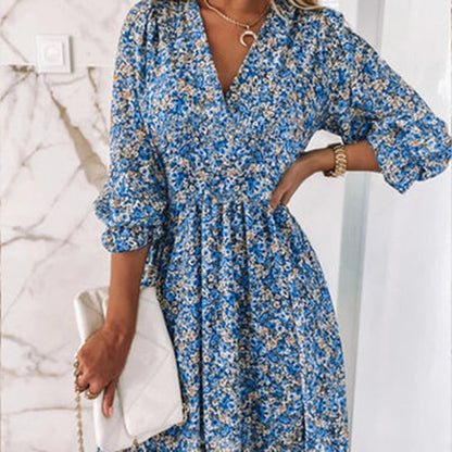 Woman wearing a floral dress with a flowy fit, featuring a V-neckline and ruffled hem, ideal for casual outings or special occasions.