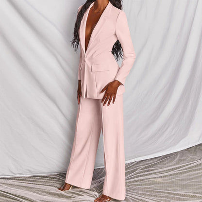 Model wearing the Victoria | Tailored Wide-Leg Blazer Set, featuring a sharp, structured blazer paired with elegant wide-leg pants. This chic set offers a sophisticated and powerful look, perfect for formal events or business occasions.