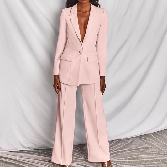 Model wearing the Victoria | Tailored Wide-Leg Blazer Set, featuring a sharp, structured blazer paired with elegant wide-leg pants. This chic set offers a sophisticated and powerful look, perfect for formal events or business occasions.