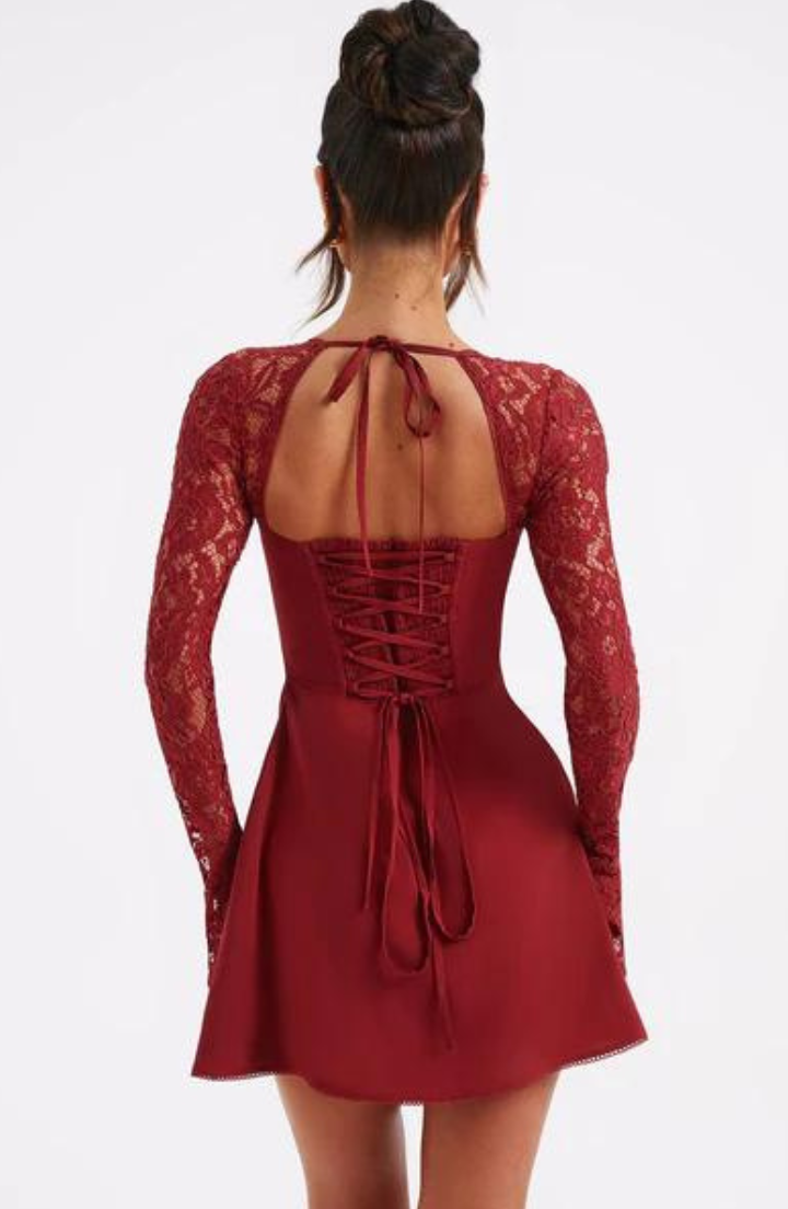Model wearing the Lily Women's Lace Sleeve Dress, an elegant mini dress with intricate lace sleeves and a flattering fitted bodice, perfect for special occasions.