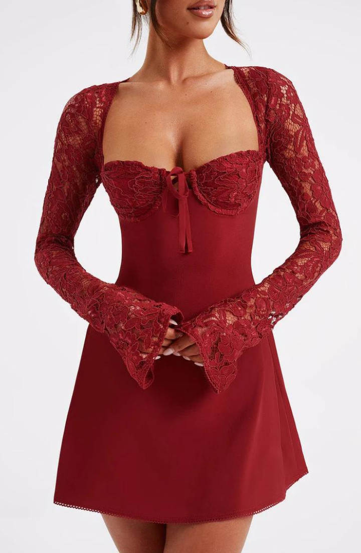 Model wearing the Lily Women's Lace Sleeve Dress, an elegant mini dress with intricate lace sleeves and a flattering fitted bodice, perfect for special occasions.