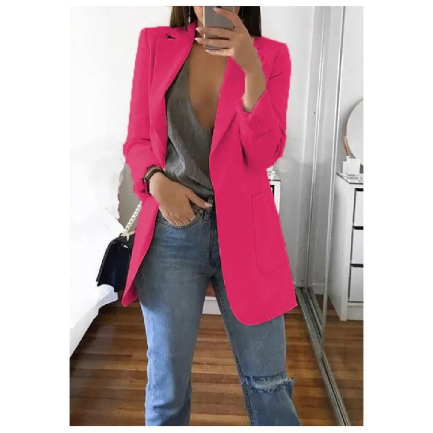 Woman wearing the elegant Sophie | Stylish Long Blazer for Women, with a structured, streamlined cut. The blazer is paired with a top and jeans, creating a smart-casual look perfect for the office or a night out.