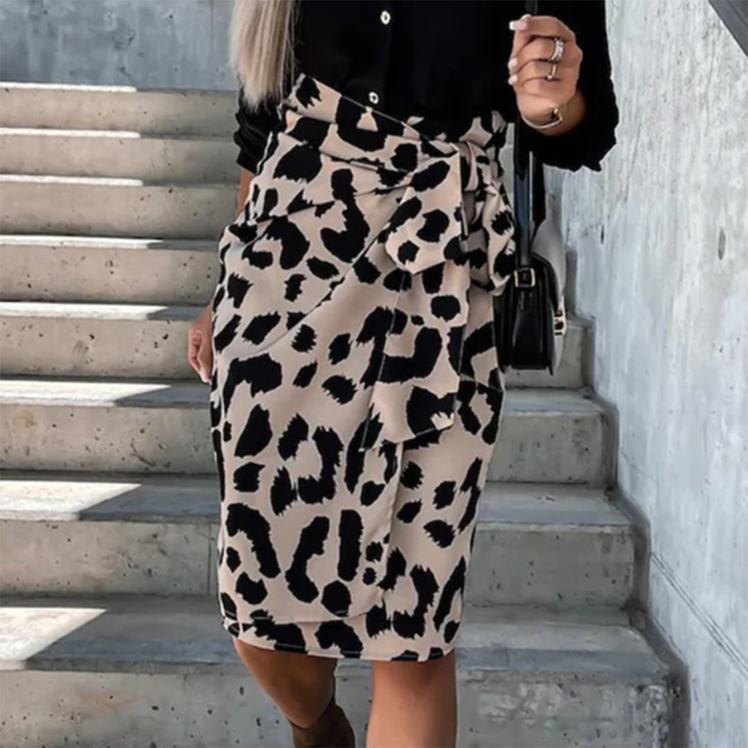 Model wearing the Samantha | Animal Print Wrap Skirt, featuring a bold animal print pattern and a flattering wrap design. This chic skirt adds a fierce touch to any outfit, perfect for day or night occasions.