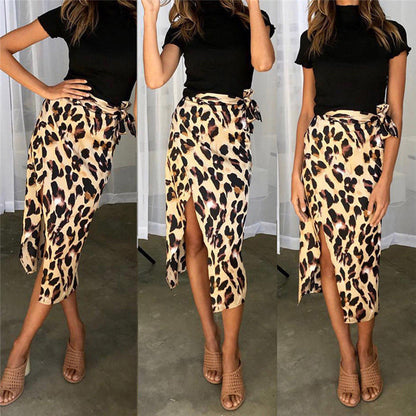 Model wearing the Samantha | Animal Print Wrap Skirt, featuring a bold animal print pattern and a flattering wrap design. This chic skirt adds a fierce touch to any outfit, perfect for day or night occasions.