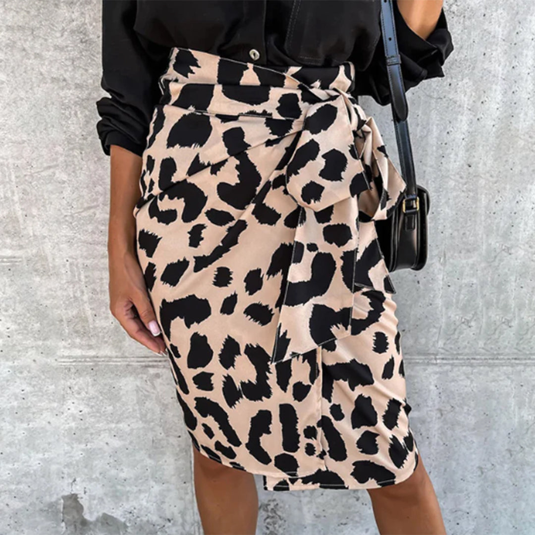 Model wearing the Samantha | Animal Print Wrap Skirt, featuring a bold animal print pattern and a flattering wrap design. This chic skirt adds a fierce touch to any outfit, perfect for day or night occasions.