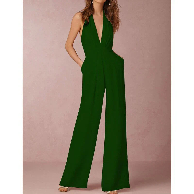 Model wearing the Bella | Plunging Halter Jumpsuit featuring a deep neckline, fitted waist, and flowing wide-leg silhouette, perfect for making a bold fashion statement at formal events or special occasions.