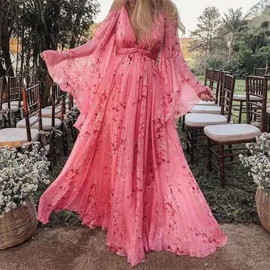 Model wearing the Isabella | Flowing Bohemian Maxi Dress, featuring a flowing silhouette and bell sleeves, perfect for capturing a romantic, free-spirited look at any special occasion or outdoor event.