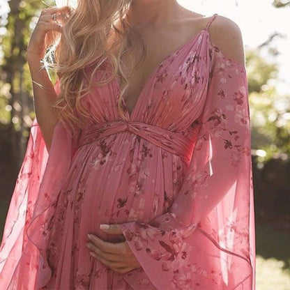 Model wearing the Isabella | Flowing Bohemian Maxi Dress, featuring a flowing silhouette and bell sleeves, perfect for capturing a romantic, free-spirited look at any special occasion or outdoor event.