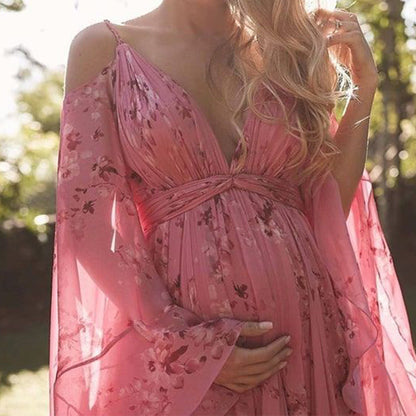 Model wearing the Isabella | Flowing Bohemian Maxi Dress, featuring a flowing silhouette and bell sleeves, perfect for capturing a romantic, free-spirited look at any special occasion or outdoor event.