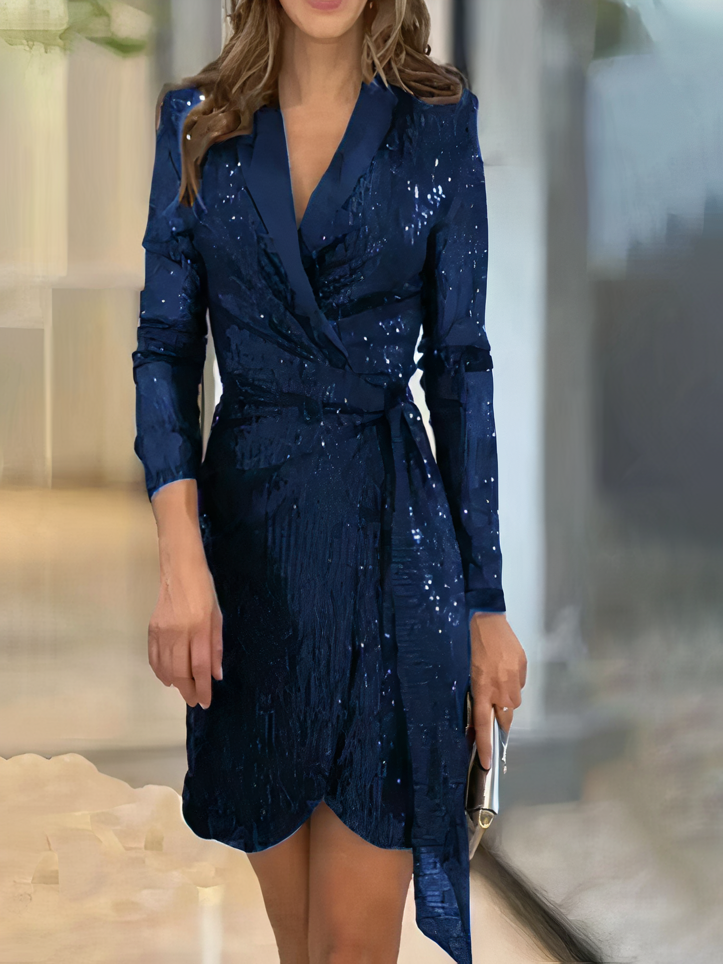 An elegant party dress featuring a sequin wrap design with long sleeves, a tailored fit, and a stylish silhouette. Perfect for evening events and celebrations, this dress combines sophistication with a touch of sparkle for a standout look.