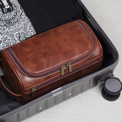  Stylish and compact toiletry bag with a durable design, featuring multiple zippers and a convenient handle for easy carrying, ideal for organizing essentials during travel.