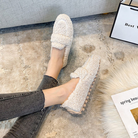 Plush slip-on women's shoes with a cozy and soft design, offering ultimate comfort and style for casual outings or indoor wear.