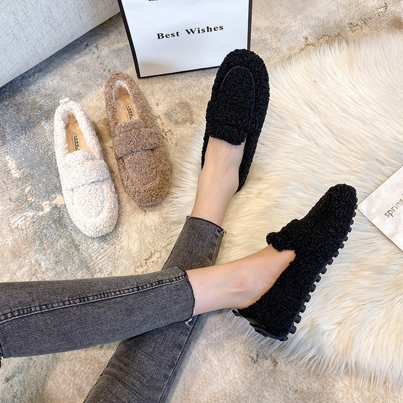 Plush slip-on women's shoes with a cozy and soft design, offering ultimate comfort and style for casual outings or indoor wear.