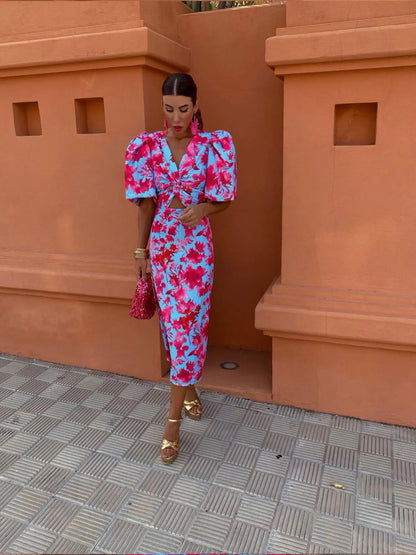 Model wearing the Amelia | Women's Statement Puff-Sleeve Dress | Vibrant Print Dress, featuring dramatic puff sleeves and a form-flattering design, paired with bold accessories for an elegant and stylish look.