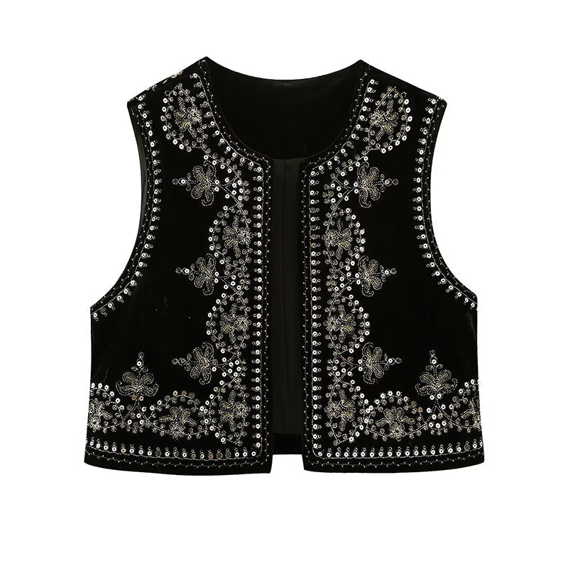 Sleeveless women's vest featuring intricate embellishments and bohemian-inspired detailing, adding a touch of elegance and unique style to any outfit.