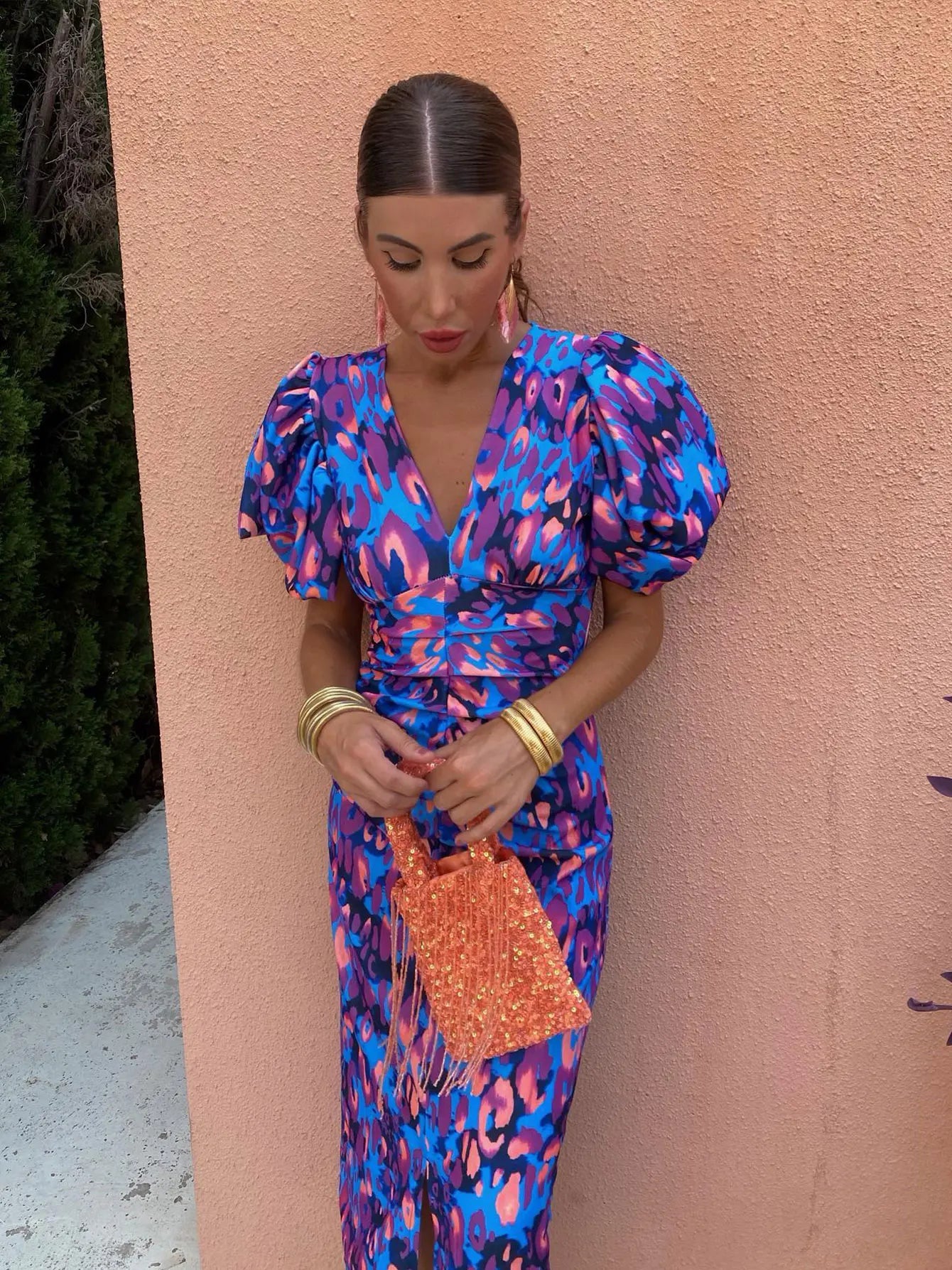 Model wearing the Amelia | Women's Statement Puff-Sleeve Dress | Vibrant Print Dress, featuring dramatic puff sleeves and a form-flattering design, paired with bold accessories for an elegant and stylish look.