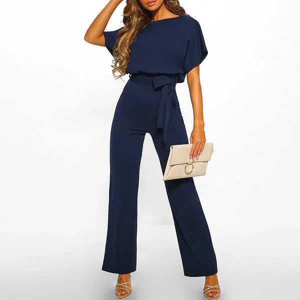 Model wearing the Jasmine | Stylish Wide-Leg Jumpsuit, featuring a flattering tie waist and wide-leg design. This chic jumpsuit is perfect for both casual and formal occasions, offering a comfortable yet stylish look.