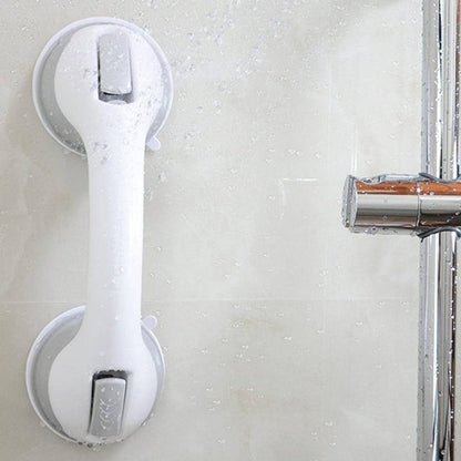  Person securing a bathroom support handle with suction cups, designed for stability and grip on smooth surfaces.