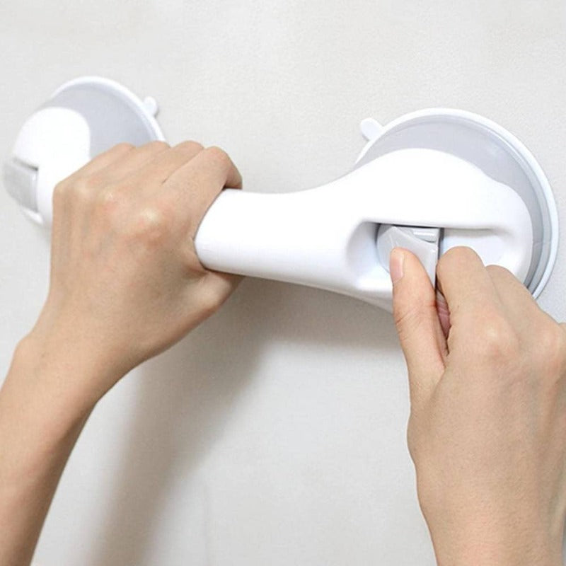  Person securing a bathroom support handle with suction cups, designed for stability and grip on smooth surfaces.