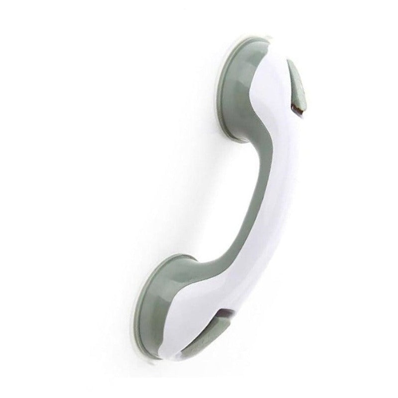  Person securing a bathroom support handle with suction cups, designed for stability and grip on smooth surfaces.