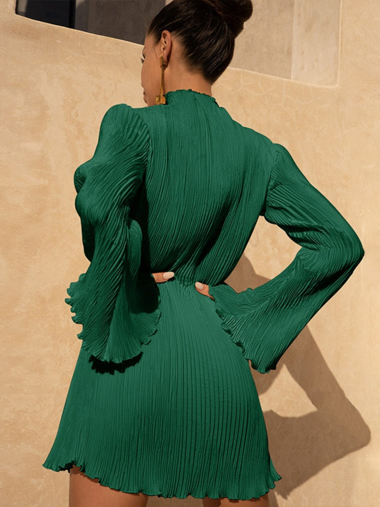 Elegant back view of a woman wearing a pleated mini dress with flowing bell sleeves, showcasing a chic and sophisticated design. Perfect for stylish occasions.