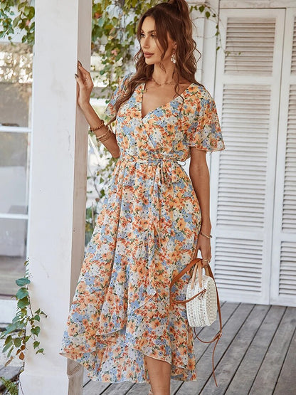 Embrace effortless elegance with the Ella Women's Floral Wrap Dress! Featuring a flattering V-neck and a flowing, floral design, this dress is perfect for casual outings or special events. Stay comfortable and chic with its lightweight fabric and timeless wrap silhouette.