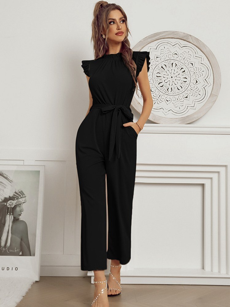 A model wearing the Sophia Women's Ruffled Jumpsuit featuring stylish ruffled sleeves, a high neckline, and a flattering tie-waist design, paired with wide-leg pants, showcasing an elegant and versatile outfit suitable for various occasions.