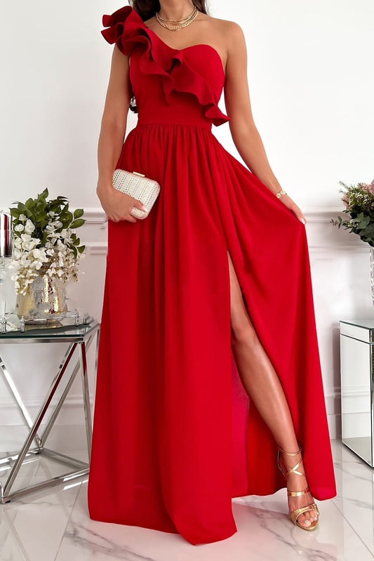 A stylish woman wearing the Sophia | Women's Elegant Maxi Dress | Party Dress, featuring a one-shoulder design with ruffled detailing, a fitted bodice, and a flowing maxi skirt with a high side slit, accessorized with a clutch and strappy heels.