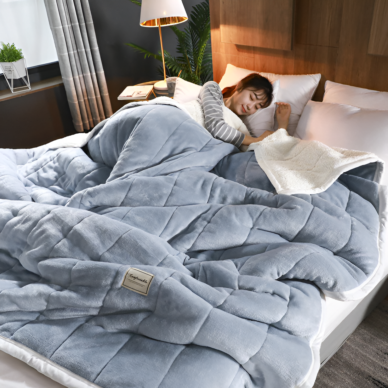 Plush bedding set featuring a cozy blanket and pillows, creating a luxurious and comfortable sleeping environment, shown in a serene bedroom setting with a person peacefully resting.