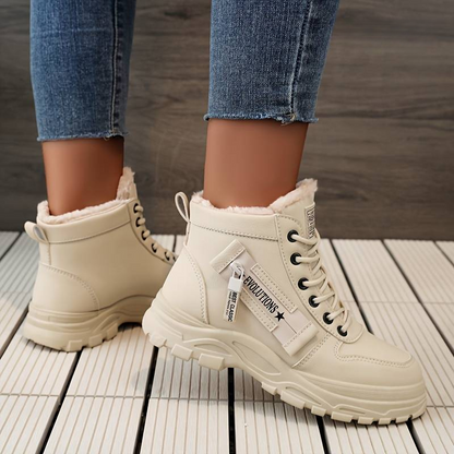 Stylish women's durable boots designed for comfort and warmth, featuring a cozy interior lining and sturdy soles, perfect for winter wear.