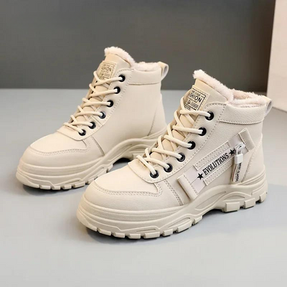 Stylish women's durable boots designed for comfort and warmth, featuring a cozy interior lining and sturdy soles, perfect for winter wear.