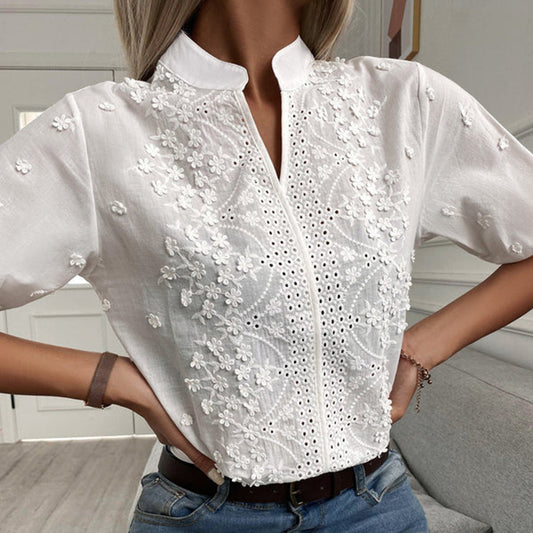 Model wearing the Elise | Embroidered Button-Up Blouse, featuring intricate floral embroidery and a polished button-up design. This elegant blouse is perfect for both casual and formal occasions, adding a touch of sophistication to any outfit.