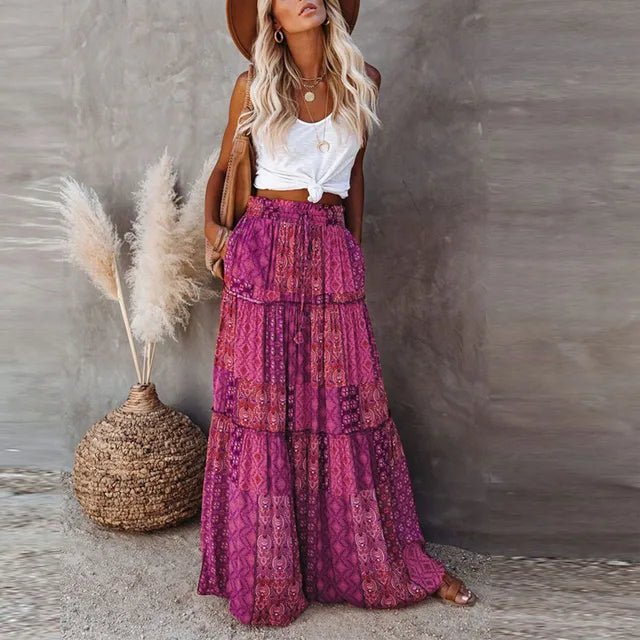 Model wearing the Sienna Women's Bohemian Skirt, featuring a tiered maxi design with a flowy silhouette, styled with a casual top and accessories for a boho-chic look.