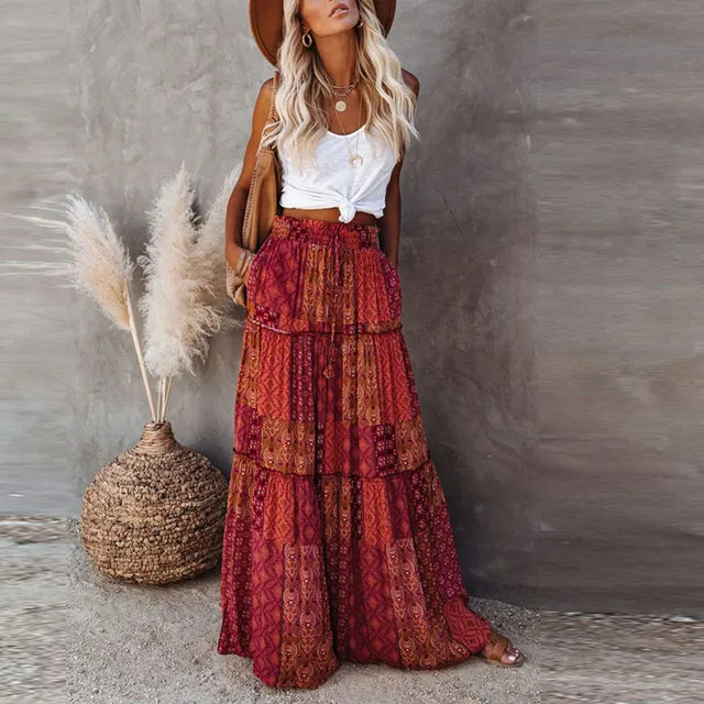 Model wearing the Sienna Women's Bohemian Skirt, featuring a tiered maxi design with a flowy silhouette, styled with a casual top and accessories for a boho-chic look.