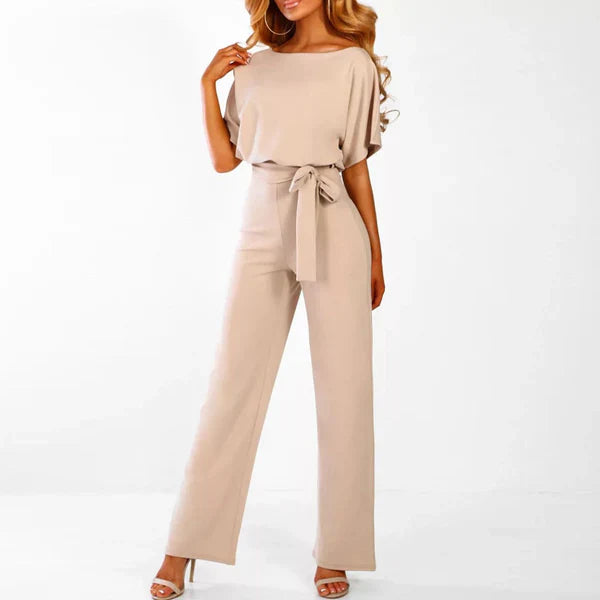 Model wearing the Jasmine | Stylish Wide-Leg Jumpsuit, featuring a flattering tie waist and wide-leg design. This chic jumpsuit is perfect for both casual and formal occasions, offering a comfortable yet stylish look.