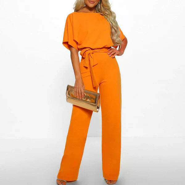 Model wearing the Jasmine | Stylish Wide-Leg Jumpsuit, featuring a flattering tie waist and wide-leg design. This chic jumpsuit is perfect for both casual and formal occasions, offering a comfortable yet stylish look.