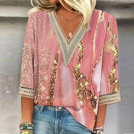 Elegant women's blouse with intricate design details, paired with jeans and accessories, perfect for casual or semi-formal occasions.