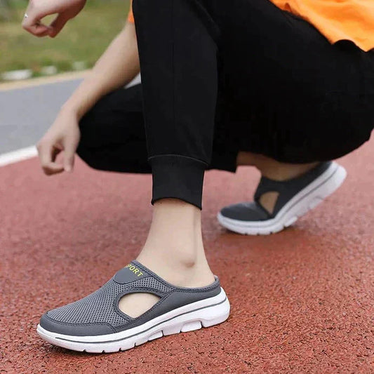 Image showing women's sporty sneakers with a breathable mesh design, featuring an open-toe and slip-on style, perfect for casual wear or active lifestyles.
