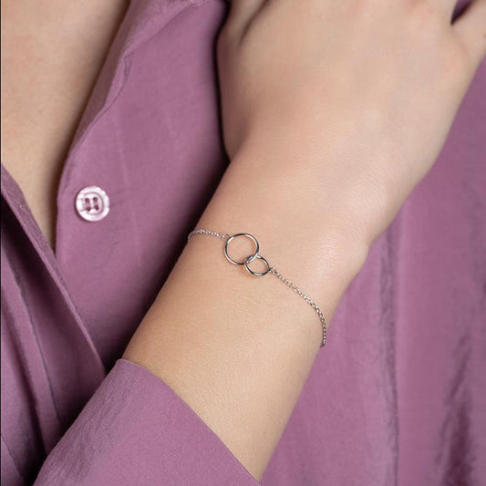 Close-up of the Mila Women's Linked Circles Bracelet featuring a delicate chain and intertwined circle design, symbolizing unity and connection in a minimalist style.