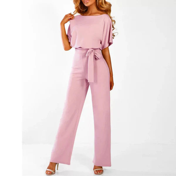 Model wearing the Jasmine | Stylish Wide-Leg Jumpsuit, featuring a flattering tie waist and wide-leg design. This chic jumpsuit is perfect for both casual and formal occasions, offering a comfortable yet stylish look.