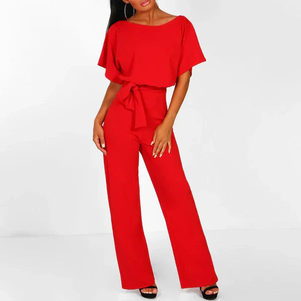 Model wearing the Jasmine | Stylish Wide-Leg Jumpsuit, featuring a flattering tie waist and wide-leg design. This chic jumpsuit is perfect for both casual and formal occasions, offering a comfortable yet stylish look.