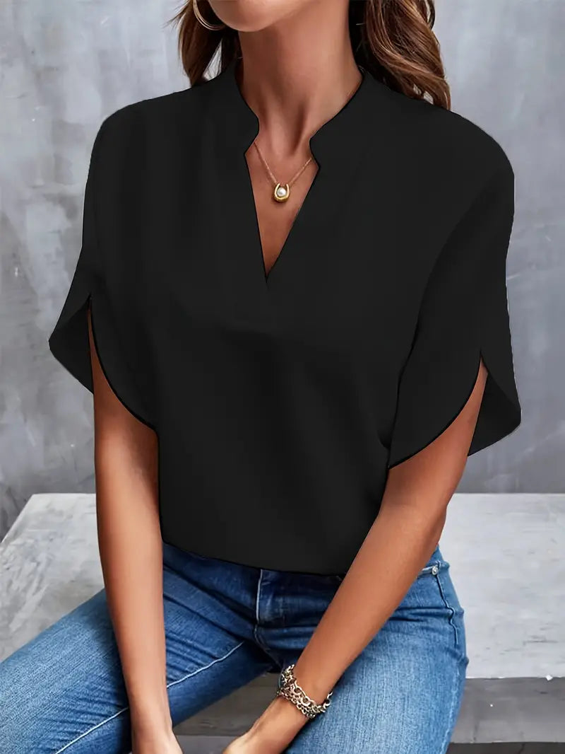 Image showing a woman wearing the Clara Women's Stylish Top, featuring a sleek and elegant design with a flattering neckline, paired with jeans for a chic and versatile look.
