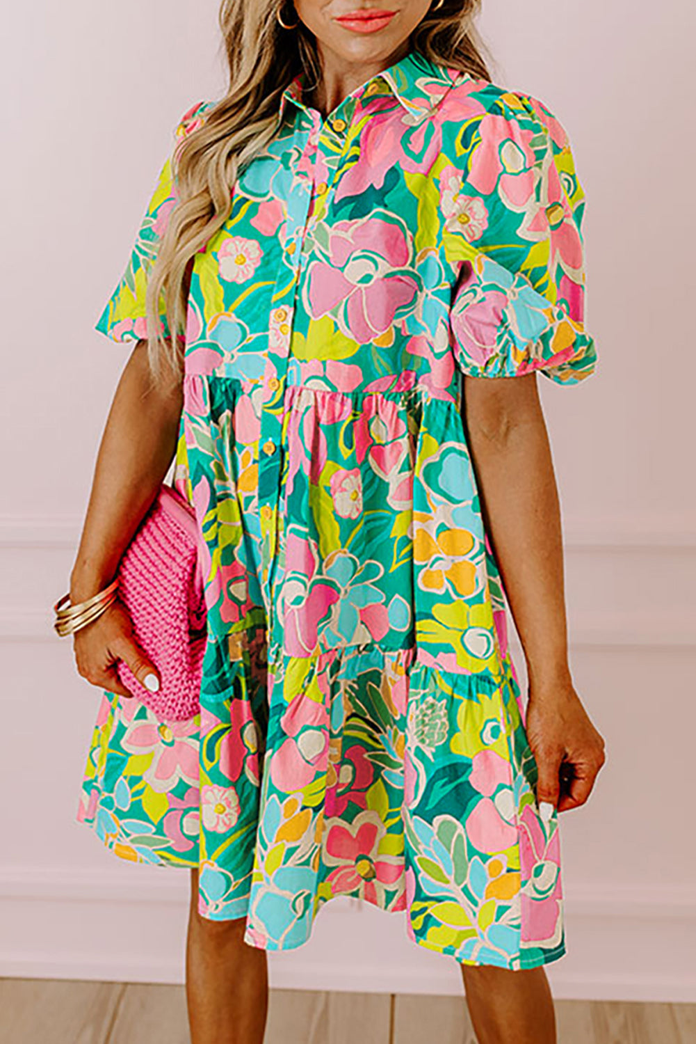 Back view of the Lily Women's Floral Tiered Dress, showcasing a vibrant floral pattern with tiered layers and short puff sleeves.