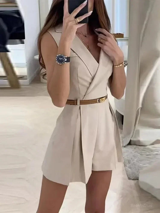 Model wearing a stylish sleeveless belted romper with a flattering V-neckline and tailored fit, perfect for casual outings or dressed-up occasions.