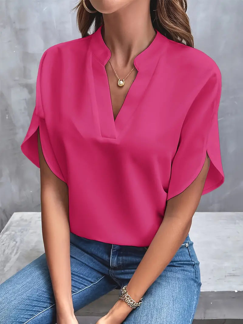 Image showing a woman wearing the Clara Women's Stylish Top, featuring a sleek and elegant design with a flattering neckline, paired with jeans for a chic and versatile look.