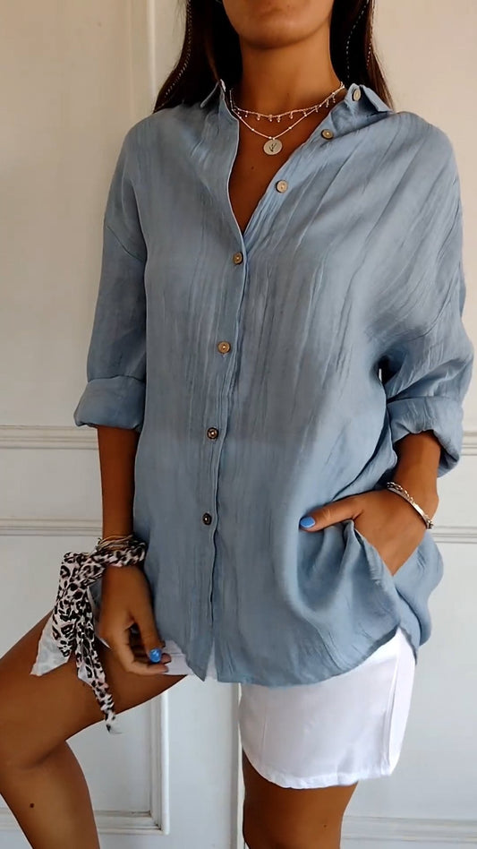 Stylish women's lightweight shirt with a relaxed fit, featuring button details and a casual, versatile design ideal for everyday wear.