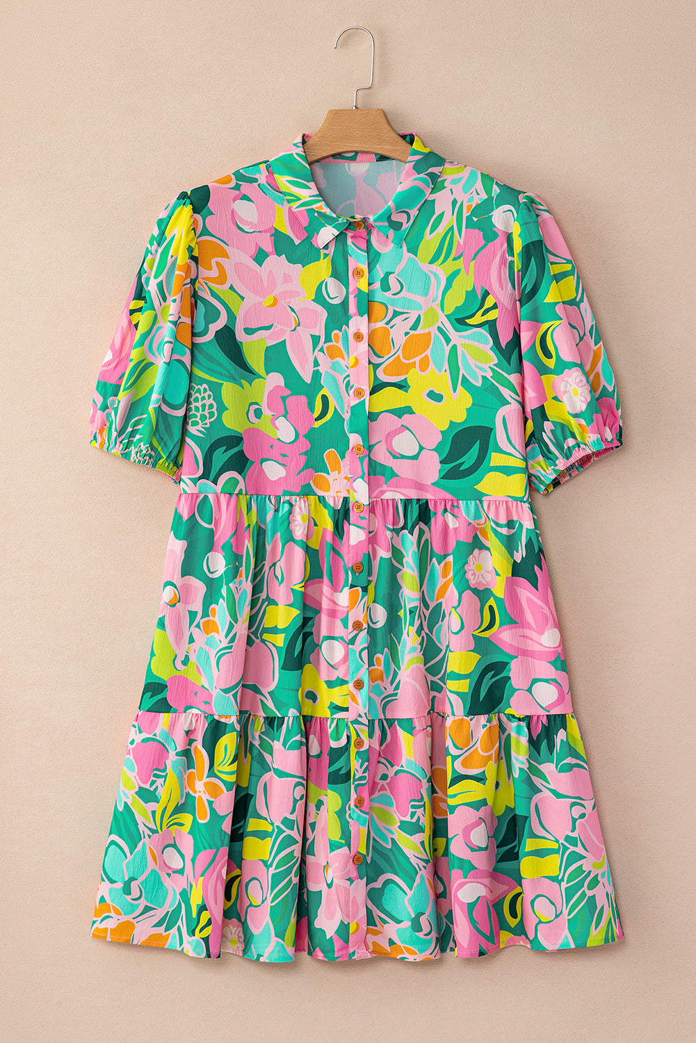 Back view of the Lily Women's Floral Tiered Dress, showcasing a vibrant floral pattern with tiered layers and short puff sleeves.