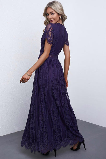 Woman wearing the Scarlett Women's Lace Maxi Dress, a bohemian-inspired dress featuring intricate lace details, a fitted bodice, and flowing skirt, accessorized with a wide-brim hat, creating a chic, free-spirited look.